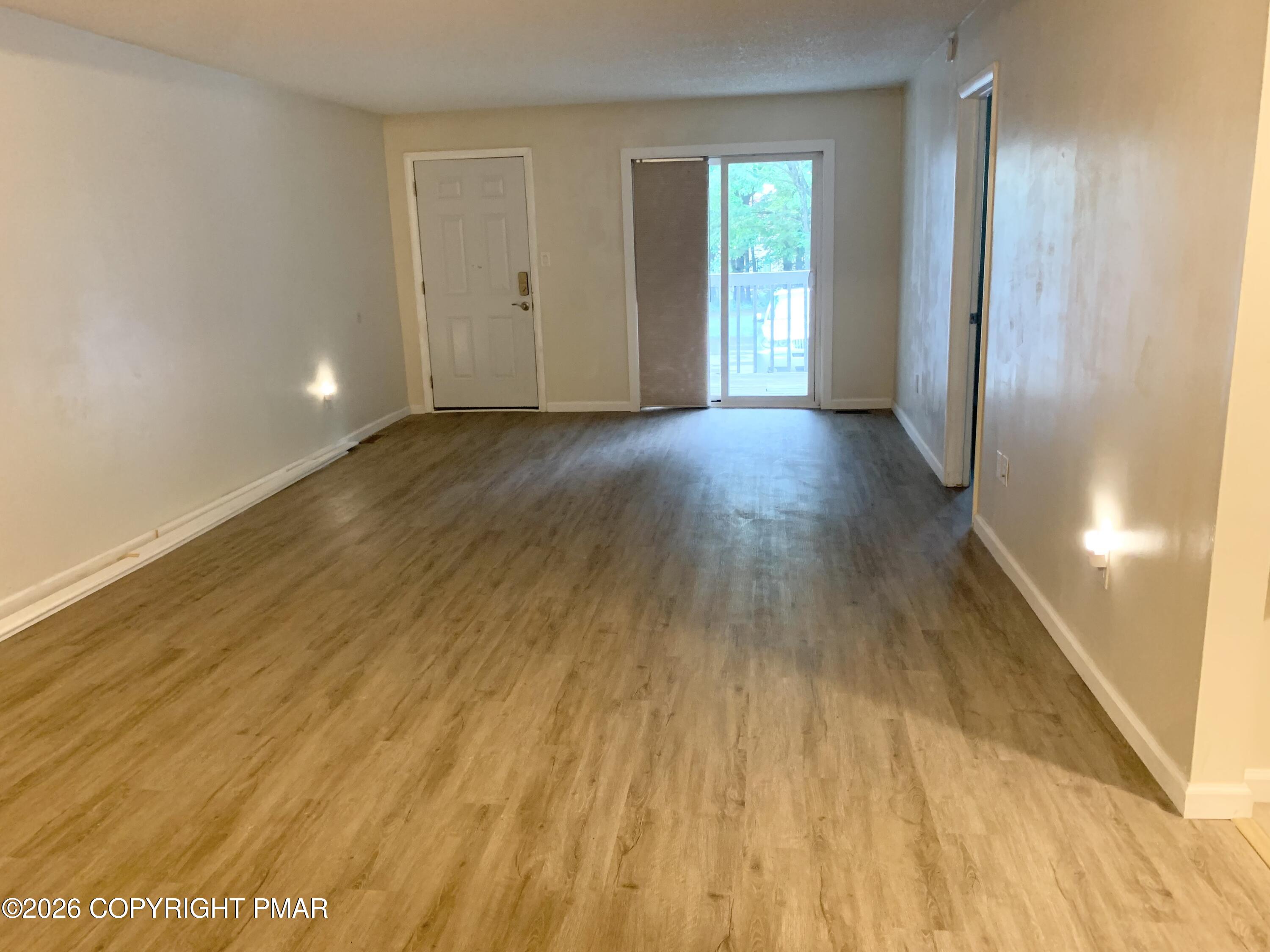 130 View Court, Unit 101 Mount Pocono, PA 18344 - Photo 2 of 8 a view of livingroom with wooden floor