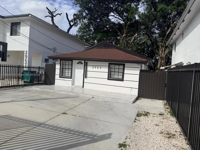 a front view of a house with a garage
