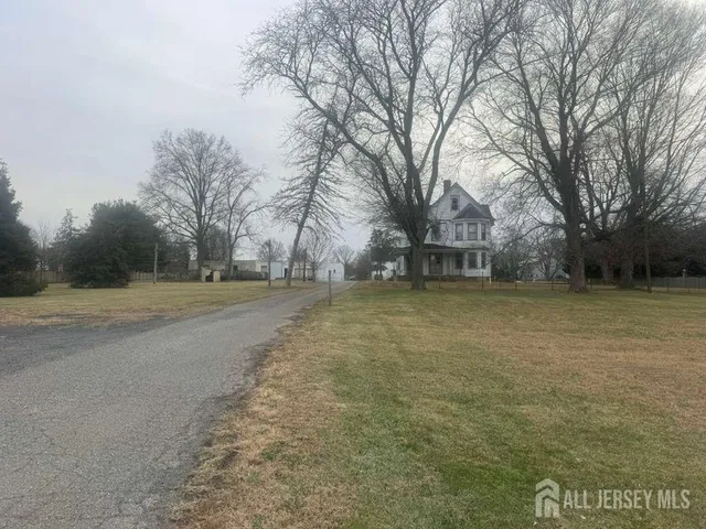 a view of a yard with trees