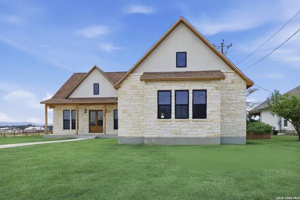 a front view of a house with a yard
