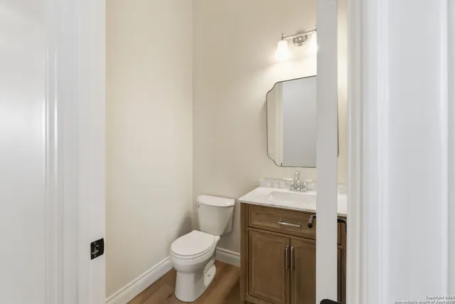 a bedroom with a large bed and a flat screen tv