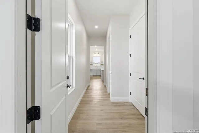 a bathroom with a granite countertop sink mirror and bathtub