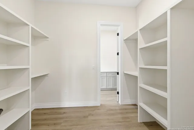 a view of an empty walk in closet
