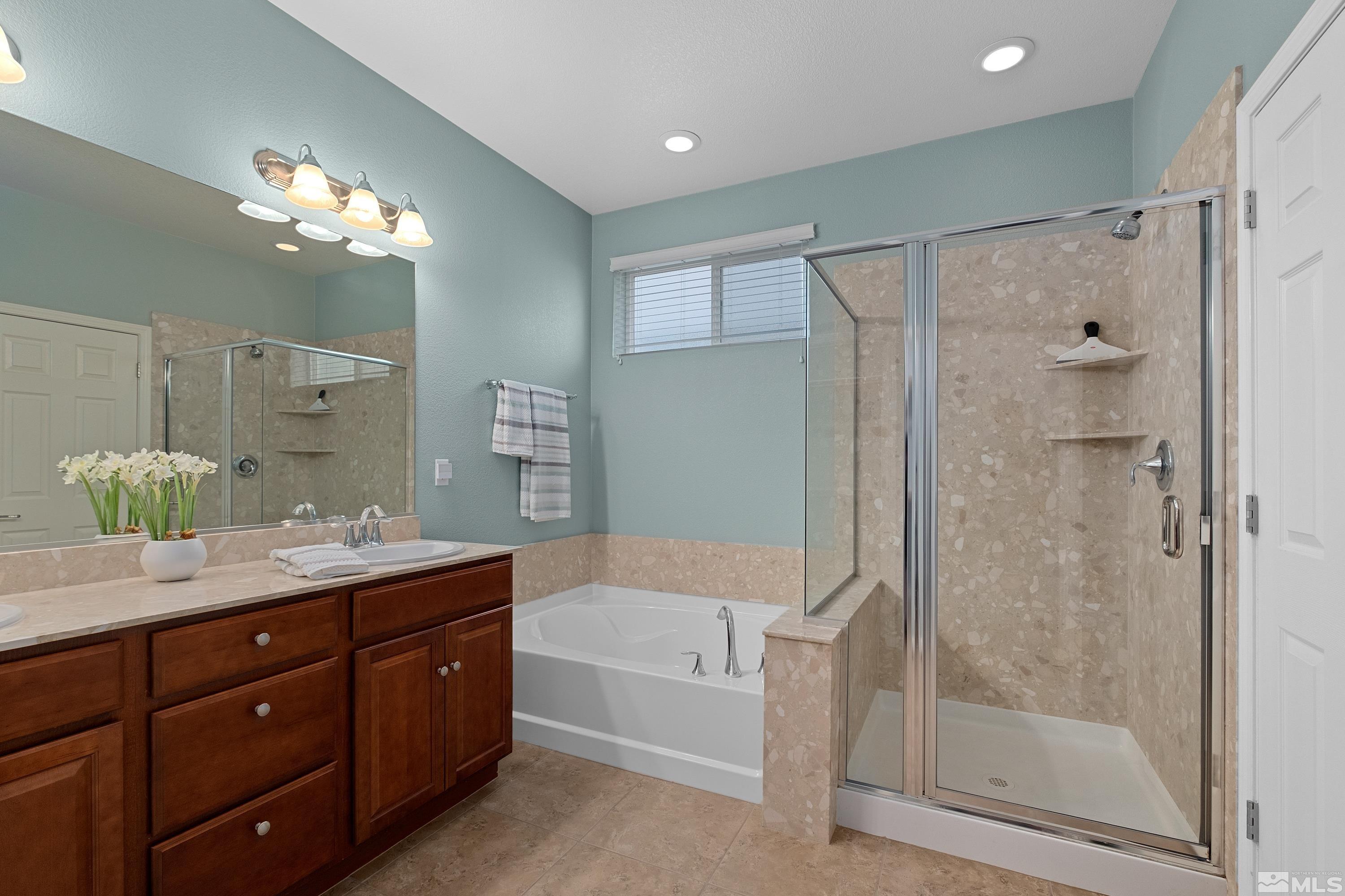 235 Brenham Avenue Reno, NV 89509 - Photo 11 of 32 a bathroom with a double vanity sink mirror and shower