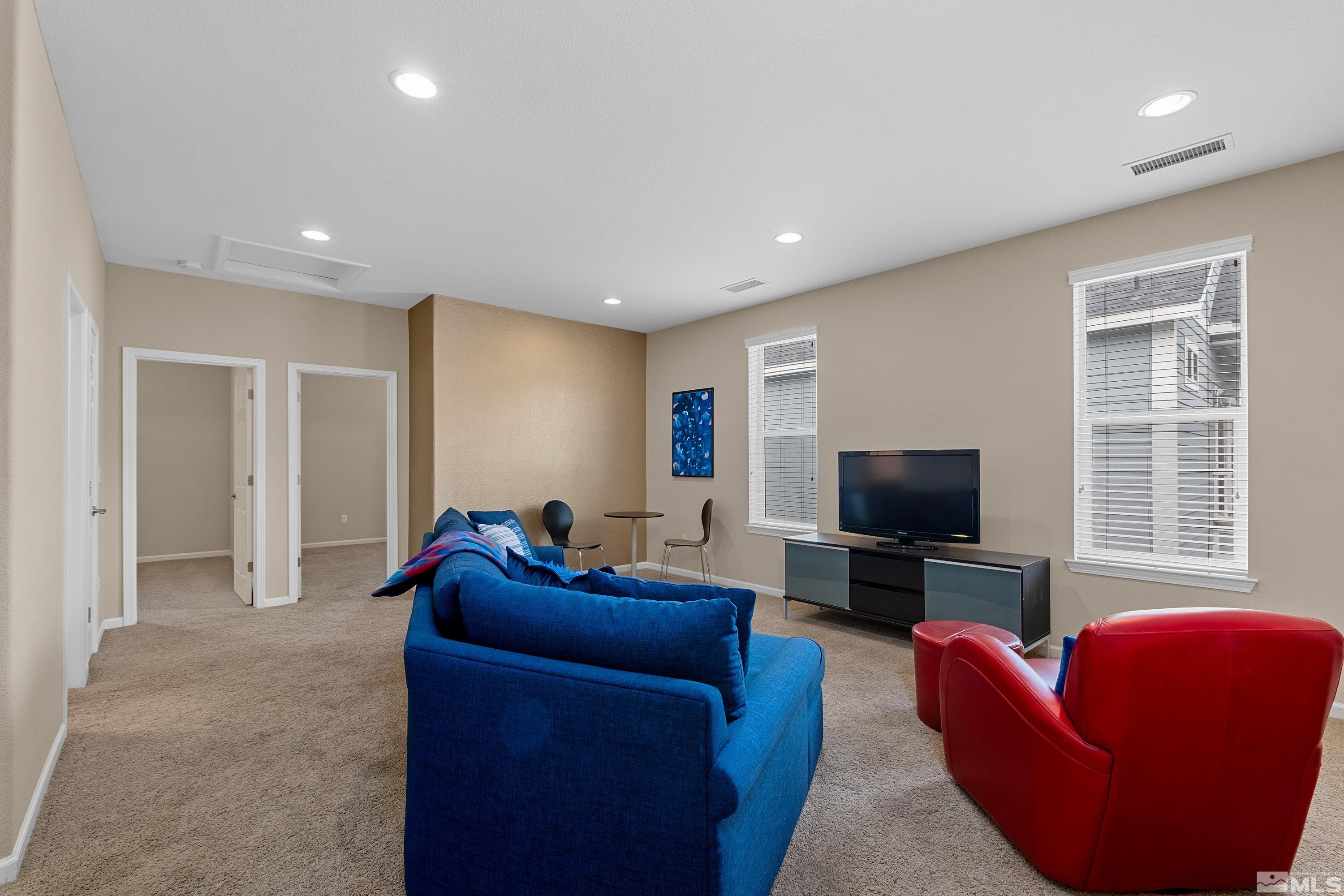 235 Brenham Avenue Reno, NV 89509 - Photo 16 of 32 a living room with furniture and a flat screen tv