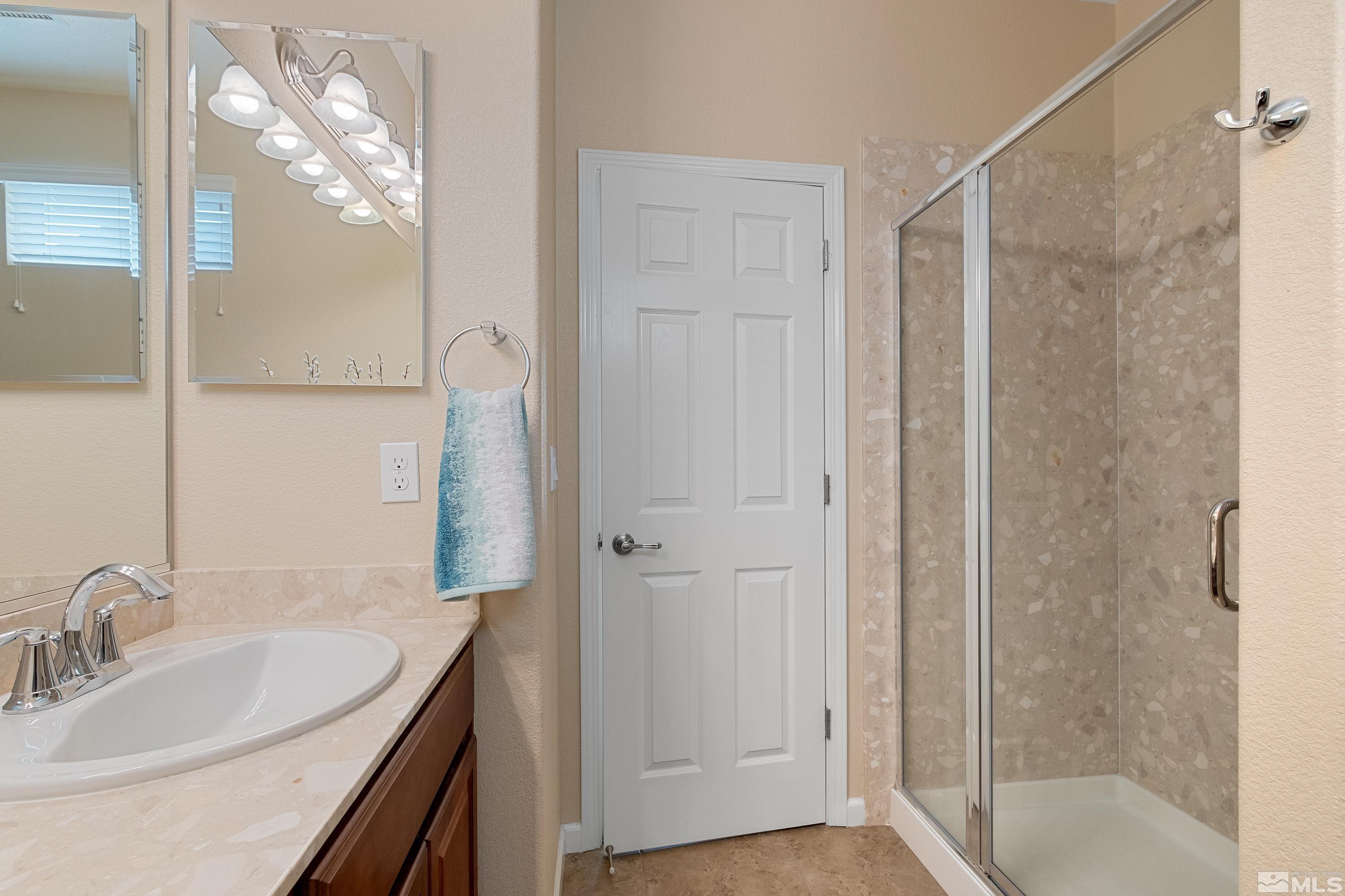235 Brenham Avenue Reno, NV 89509 - Photo 21 of 32 a bathroom with a sink and a mirror