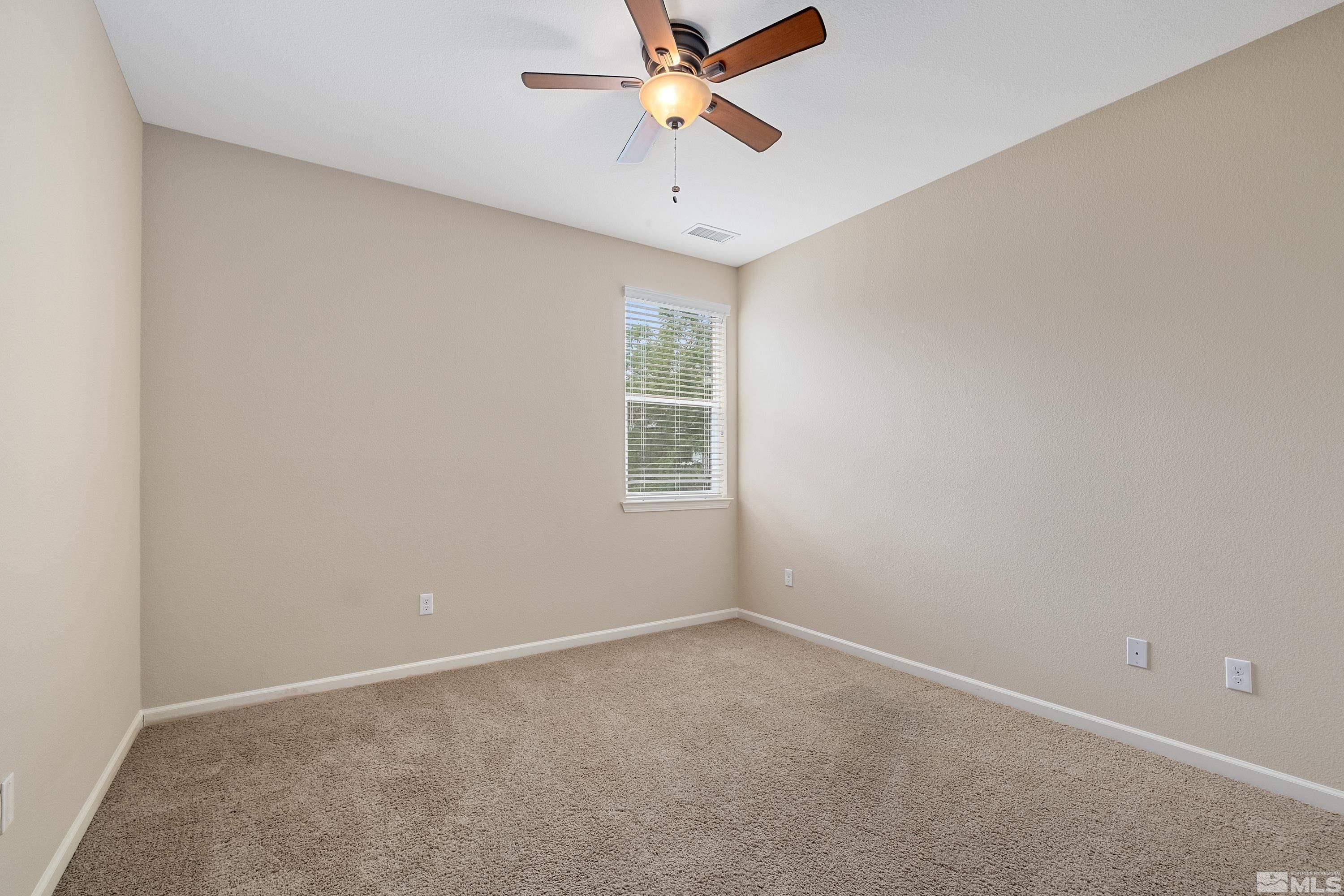 235 Brenham Avenue Reno, NV 89509 - Photo 22 of 32 an empty room with a window and a fan