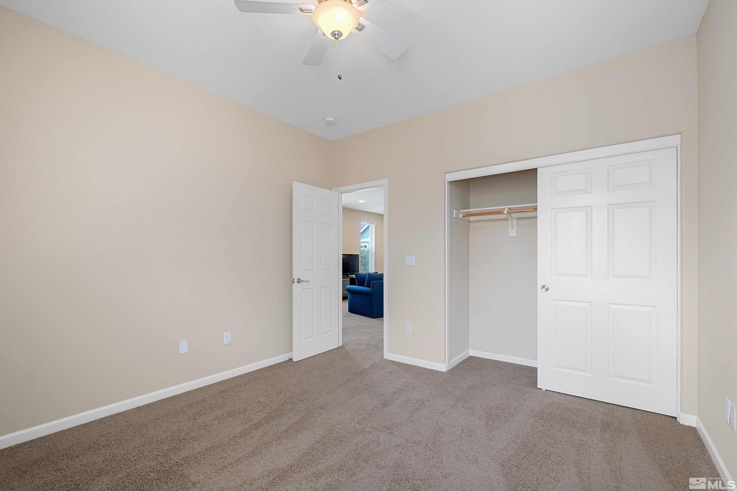 235 Brenham Avenue Reno, NV 89509 - Photo 25 of 32 a view of a big room with chandelier fan and refrigerator