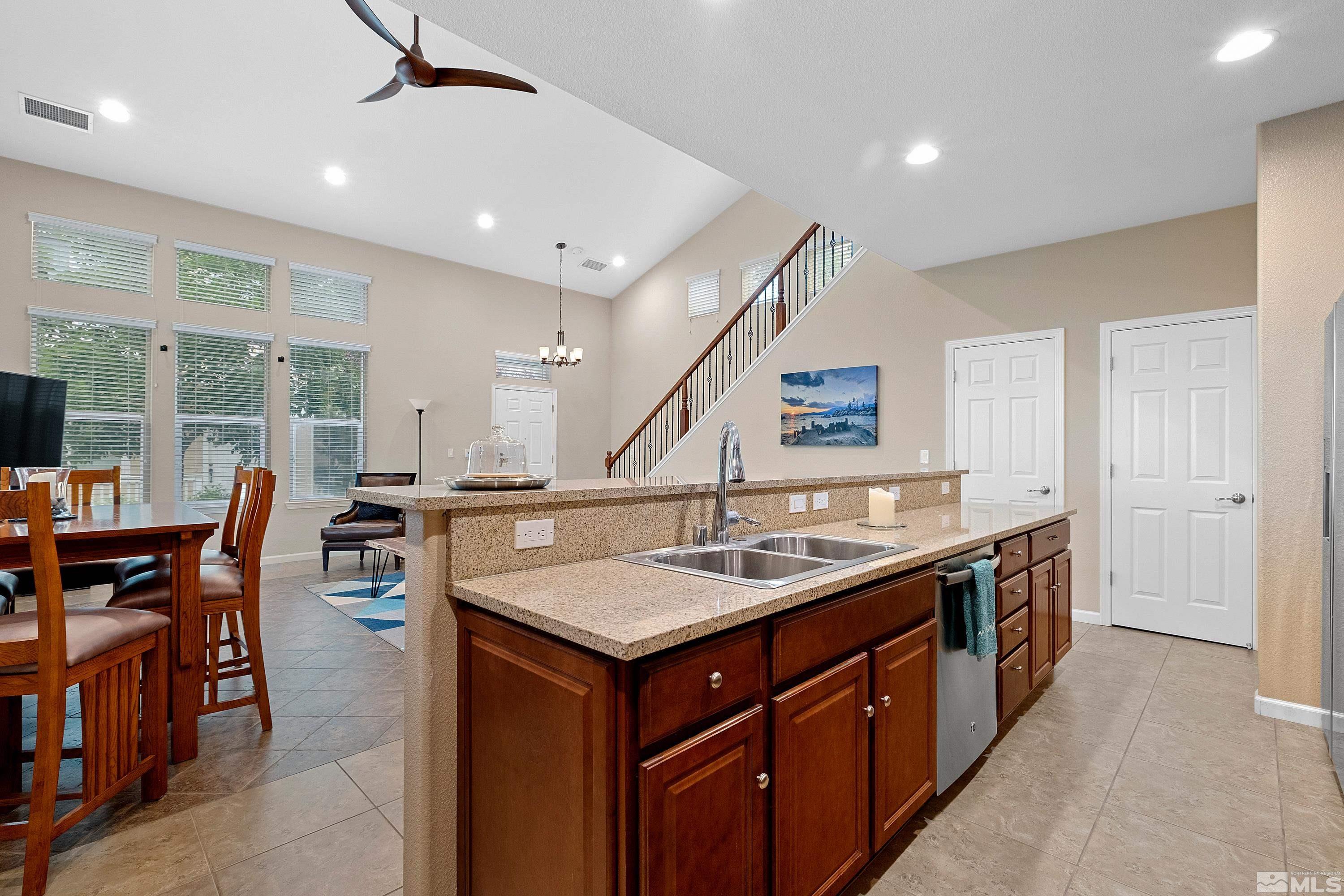 235 Brenham Avenue Reno, NV 89509 - Photo 5 of 32 a kitchen with a center island and some chairs