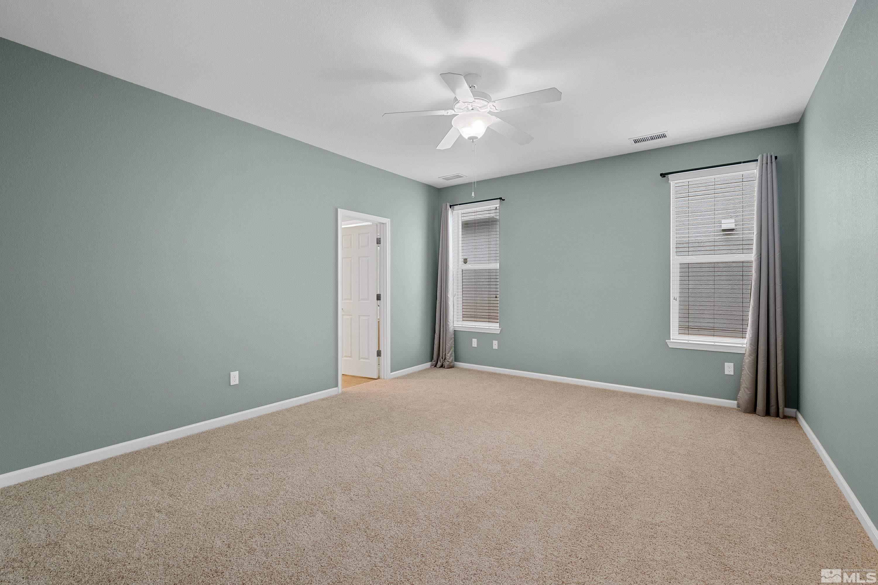 235 Brenham Avenue Reno, NV 89509 - Photo 8 of 32 a view of an empty room with a chandelier fan