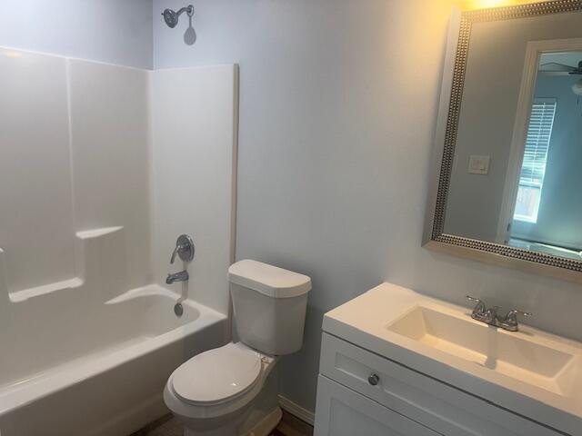 1106 North Englewood Avenue, Unit A&B Lubbock, TX 79416 - Photo 11 of 11 a white toilet sitting next to a bathroom sink and tub