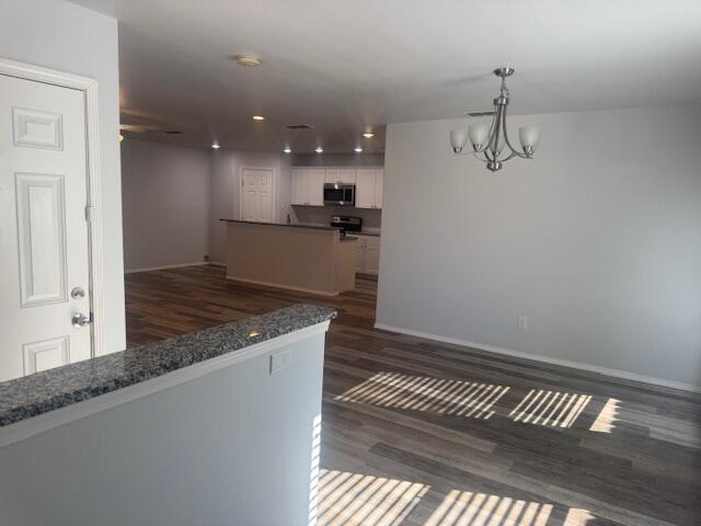 1106 North Englewood Avenue, Unit A&B Lubbock, TX 79416 - Photo 3 of 11 a kitchen with a refrigerator and countertop