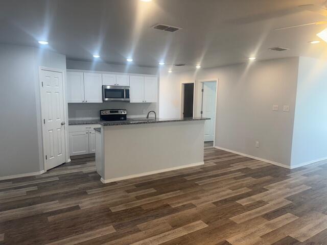 1106 North Englewood Avenue, Unit A&B Lubbock, TX 79416 - Photo 5 of 11 a view of kitchen with wooden floor