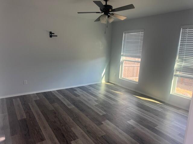 1106 North Englewood Avenue, Unit A&B Lubbock, TX 79416 - Photo 10 of 11 wooden floor in an empty room with a window