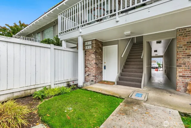 a view of a house with a small yard
