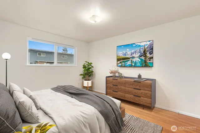 a bedroom with bed and a window