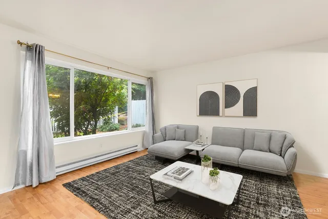 a living room with furniture and a rug