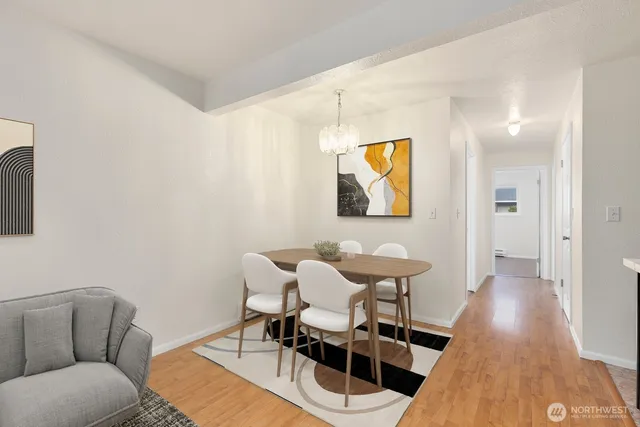 a view of a dining room with furniture and wooden floor