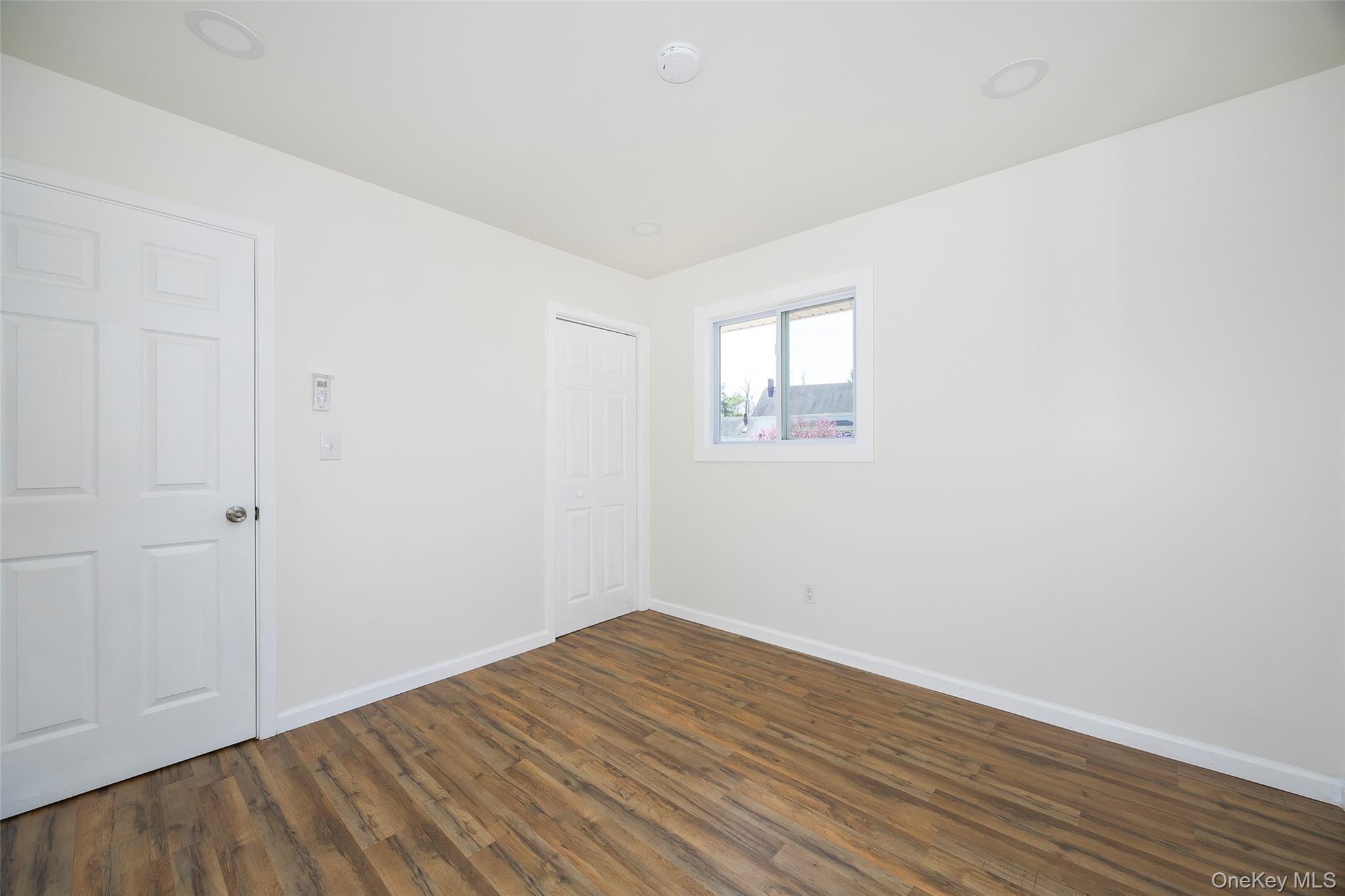 565 Old Hopewell Road Hopewell Junction, NY 12533 - Photo 14 of 23 Unfurnished room with baseboards and dark wood-style floors