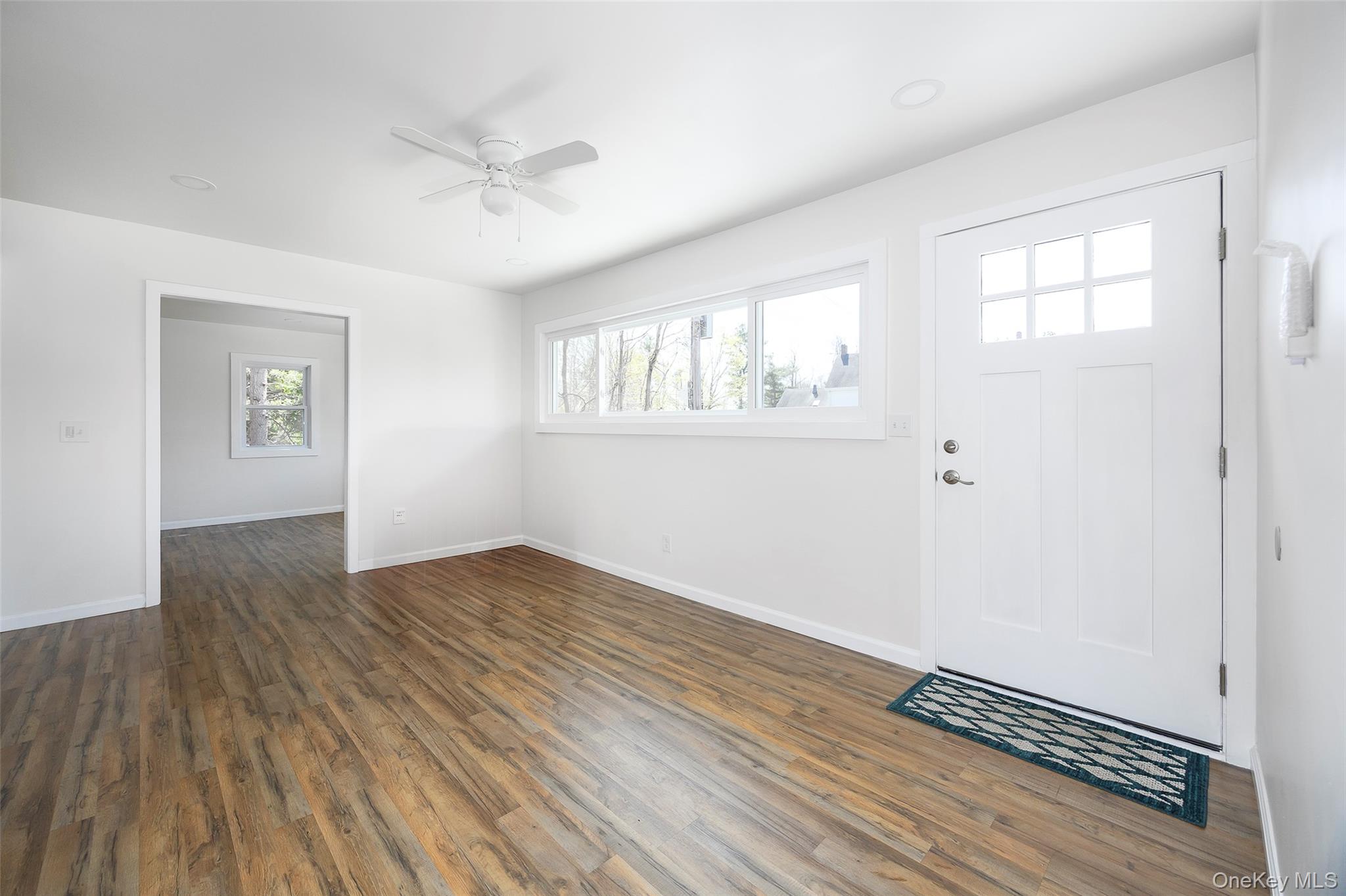 565 Old Hopewell Road Hopewell Junction, NY 12533 - Photo 15 of 23 Foyer with dark wood-style flooring and ceiling fan