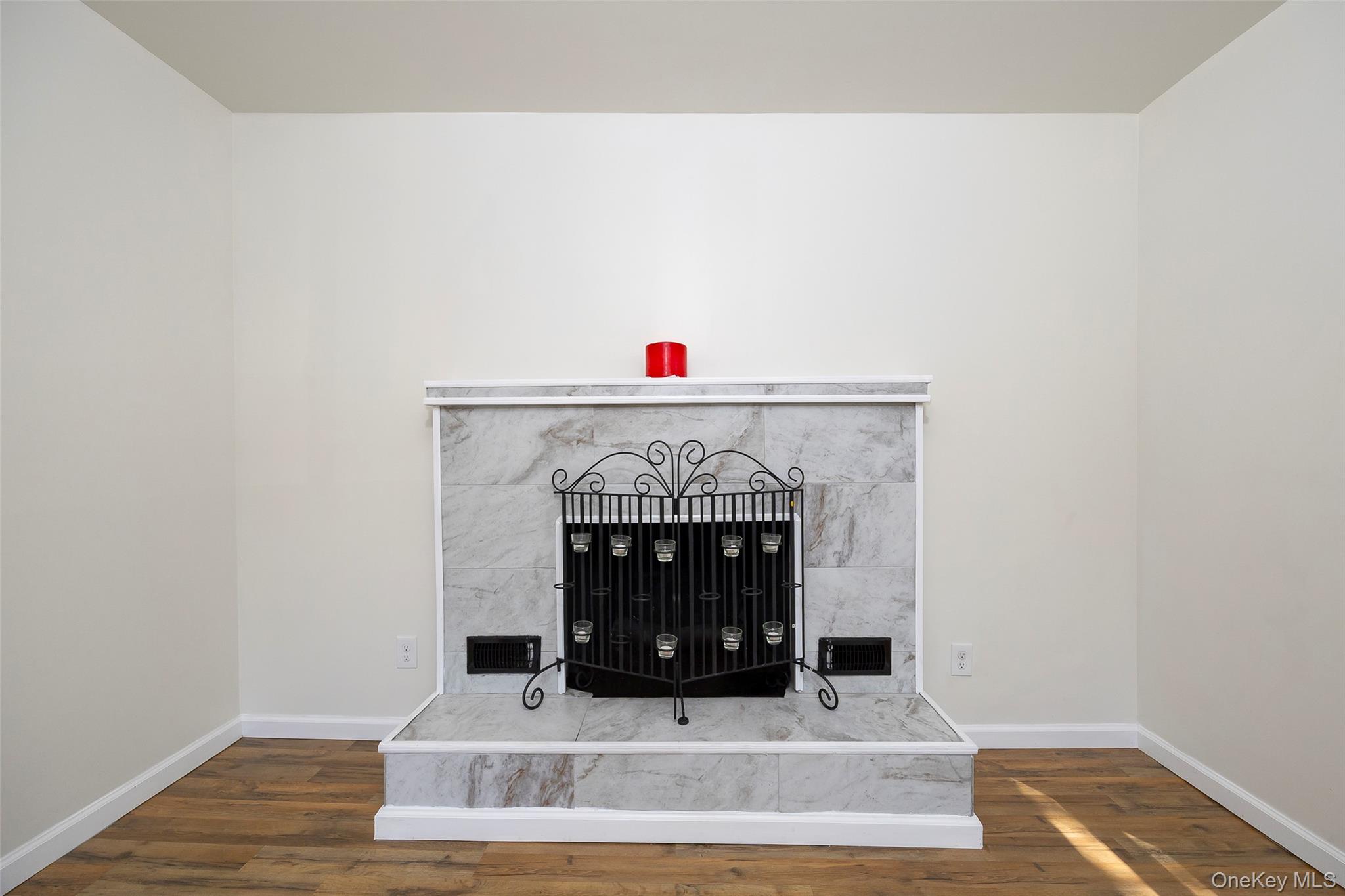 565 Old Hopewell Road Hopewell Junction, NY 12533 - Photo 7 of 23 Detailed view of wood finished floors and a premium fireplace