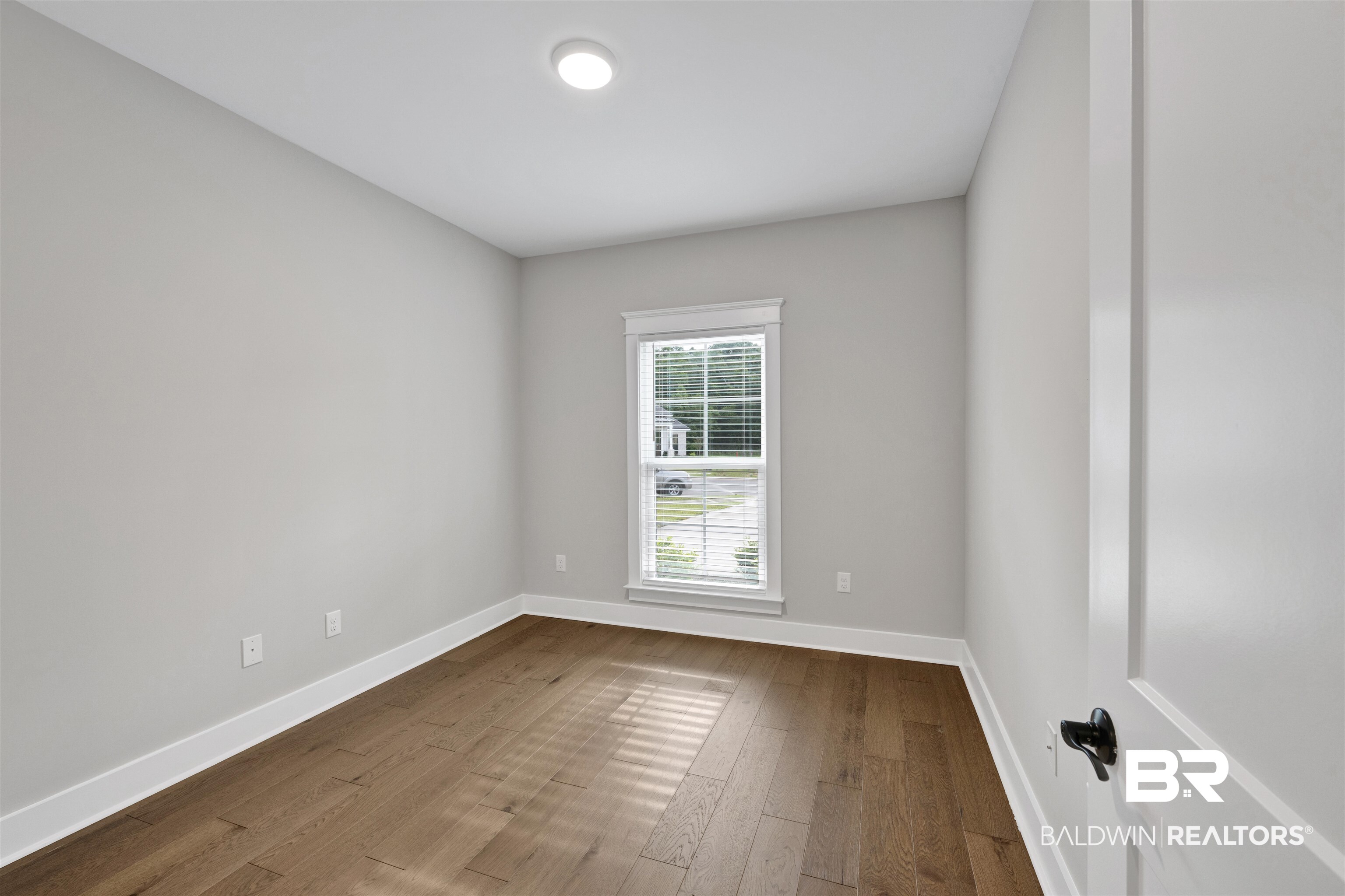 27371 Patch Pl Loop Daphne, AL 36526 - Photo 57 of 63 Room featuring wood-finish flooring, neutral wall paint, and a recessed ceiling light