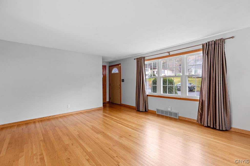159 Hopper Road Syracuse, NY 13207 - Photo 16 of 48 Spacious Living room. View of front entrance midd