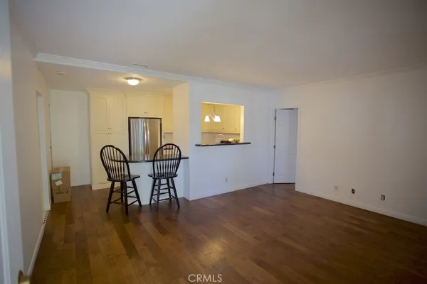 a view of a workspace with furniture and window