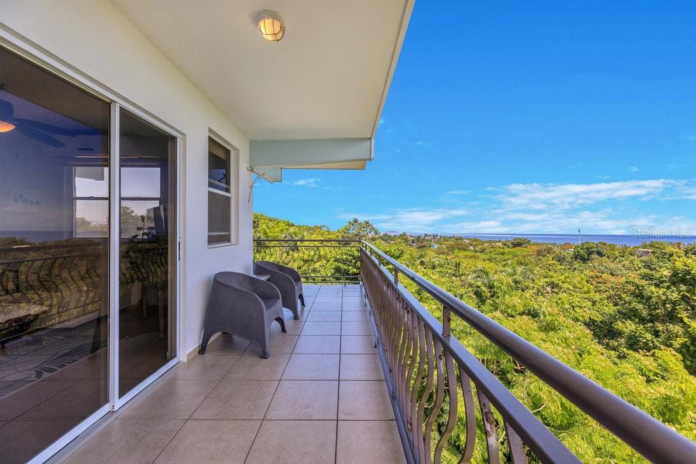 413 Camino Carretas, Unit A7 Rincon, Rincón 00677 - Photo 22 of 23 a view of balcony with furniture