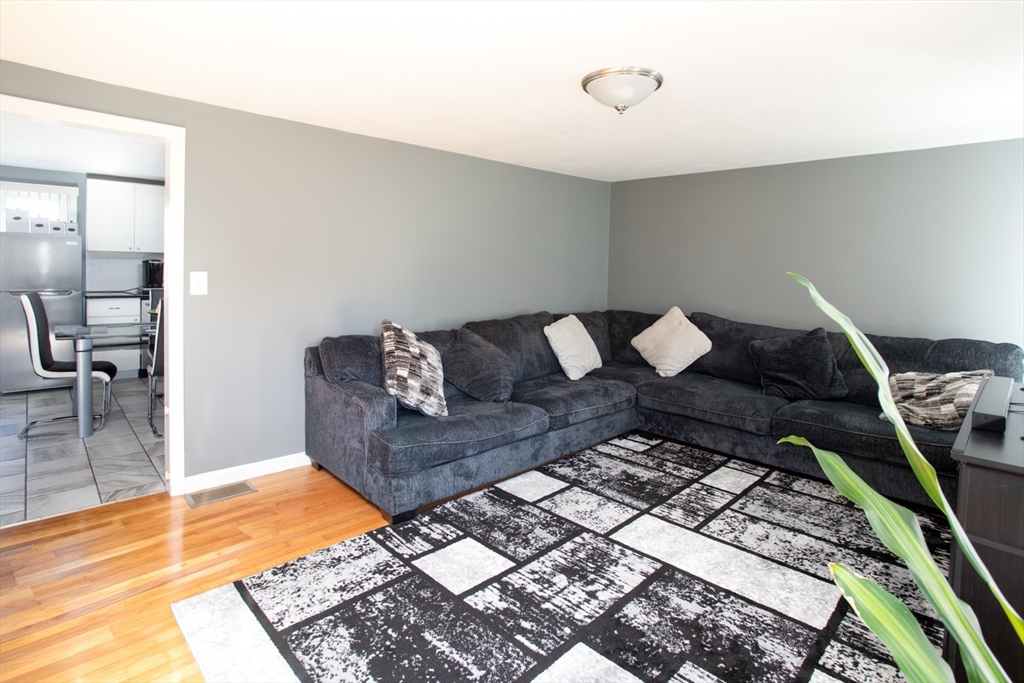 350 Gifford Road Westport, MA 02790 - Photo 12 of 39 a living room with furniture and a rug