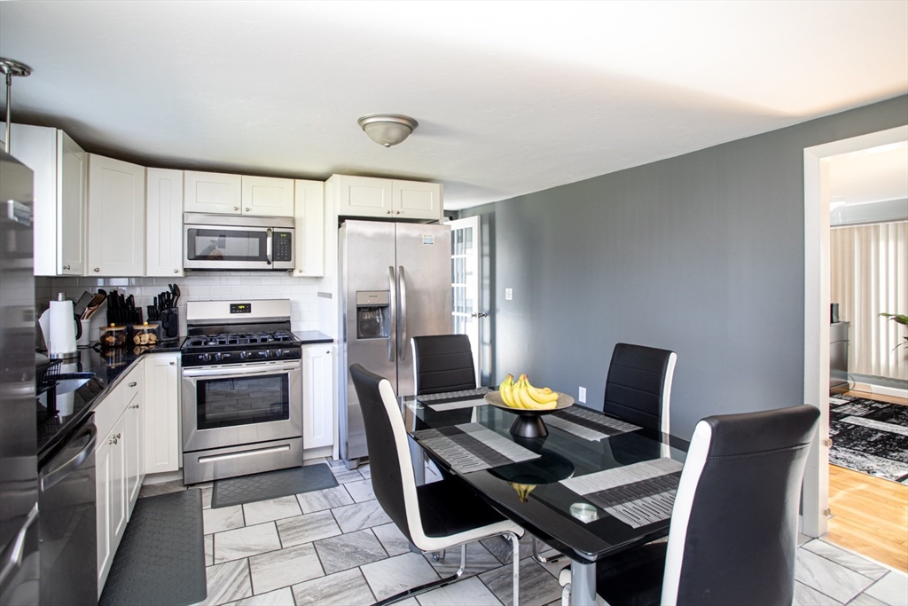 350 Gifford Road Westport, MA 02790 - Photo 15 of 39 a kitchen with a stove a refrigerator and a stove top oven