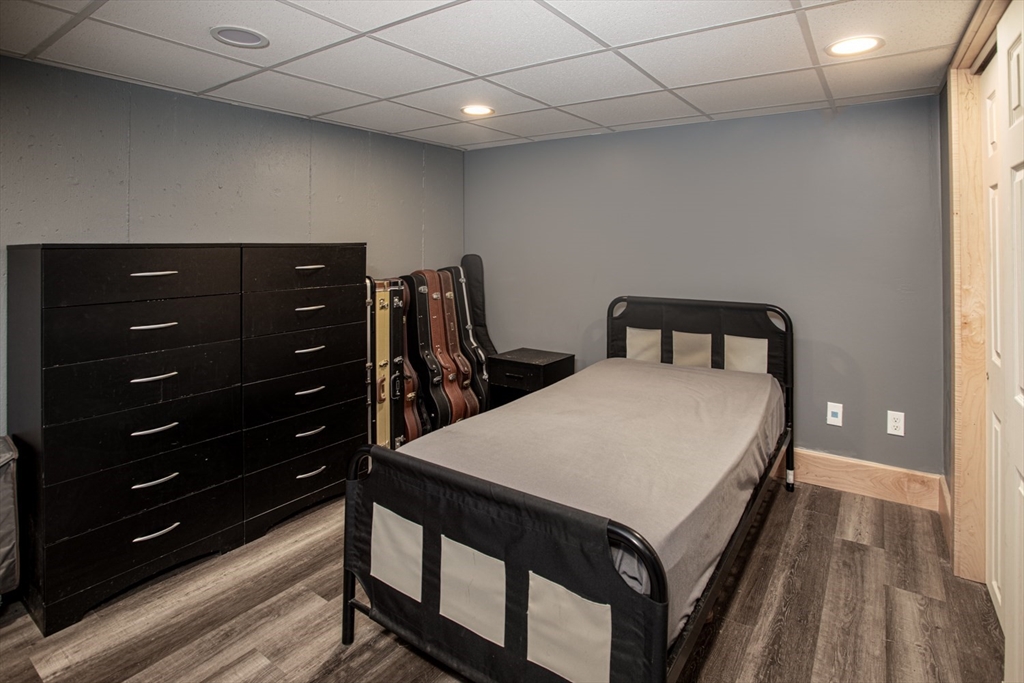 350 Gifford Road Westport, MA 02790 - Photo 35 of 39 a bed room with a bed and a dresser