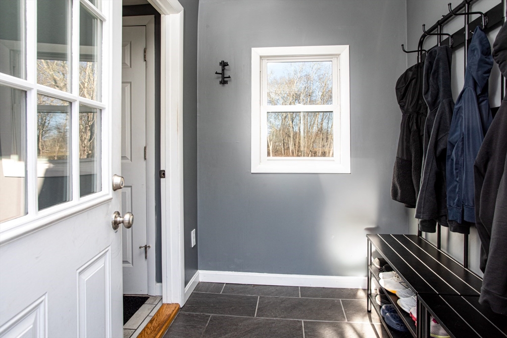 350 Gifford Road Westport, MA 02790 - Photo 37 of 39 a view of walk in closet with clothes and shoes