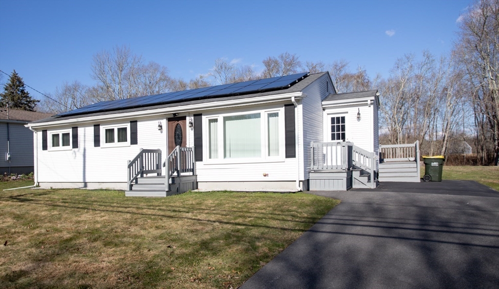 350 Gifford Road Westport, MA 02790 - Photo 4 of 39 a house view with a sitting space and garden