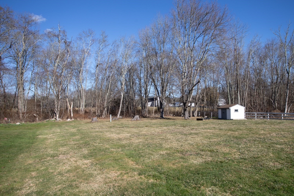350 Gifford Road Westport, MA 02790 - Photo 5 of 39 a view of a field with trees in background
