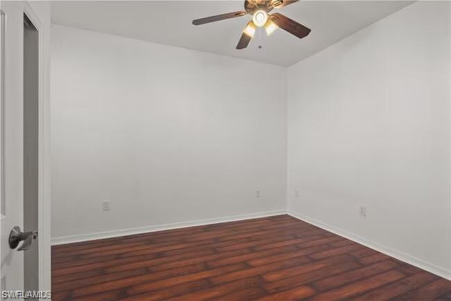 15610 Summit Pl Circle, Unit 398 Naples, FL 34119 - Photo 8 of 13 Unfurnished room with dark wood finished floors and ceiling fan