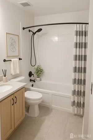 a bathroom with a granite countertop sink a toilet and shower
