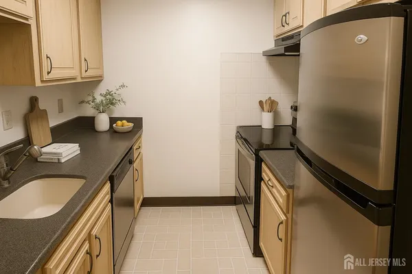 a bathroom with a granite countertop sink a washer and dryer