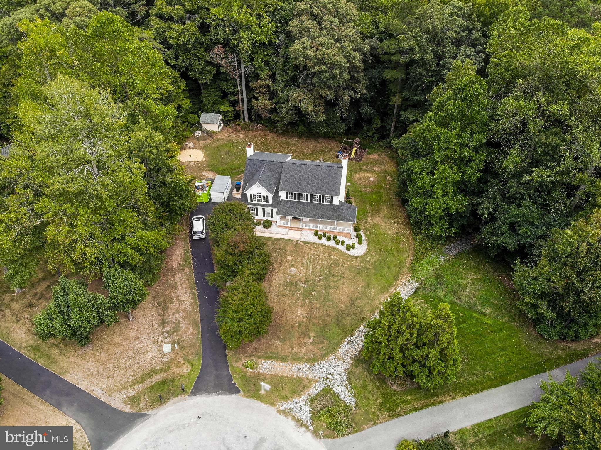721 Small Reward Road Huntingtown, MD 20639 - Photo 37 of 51 an aerial view of a house with a yard