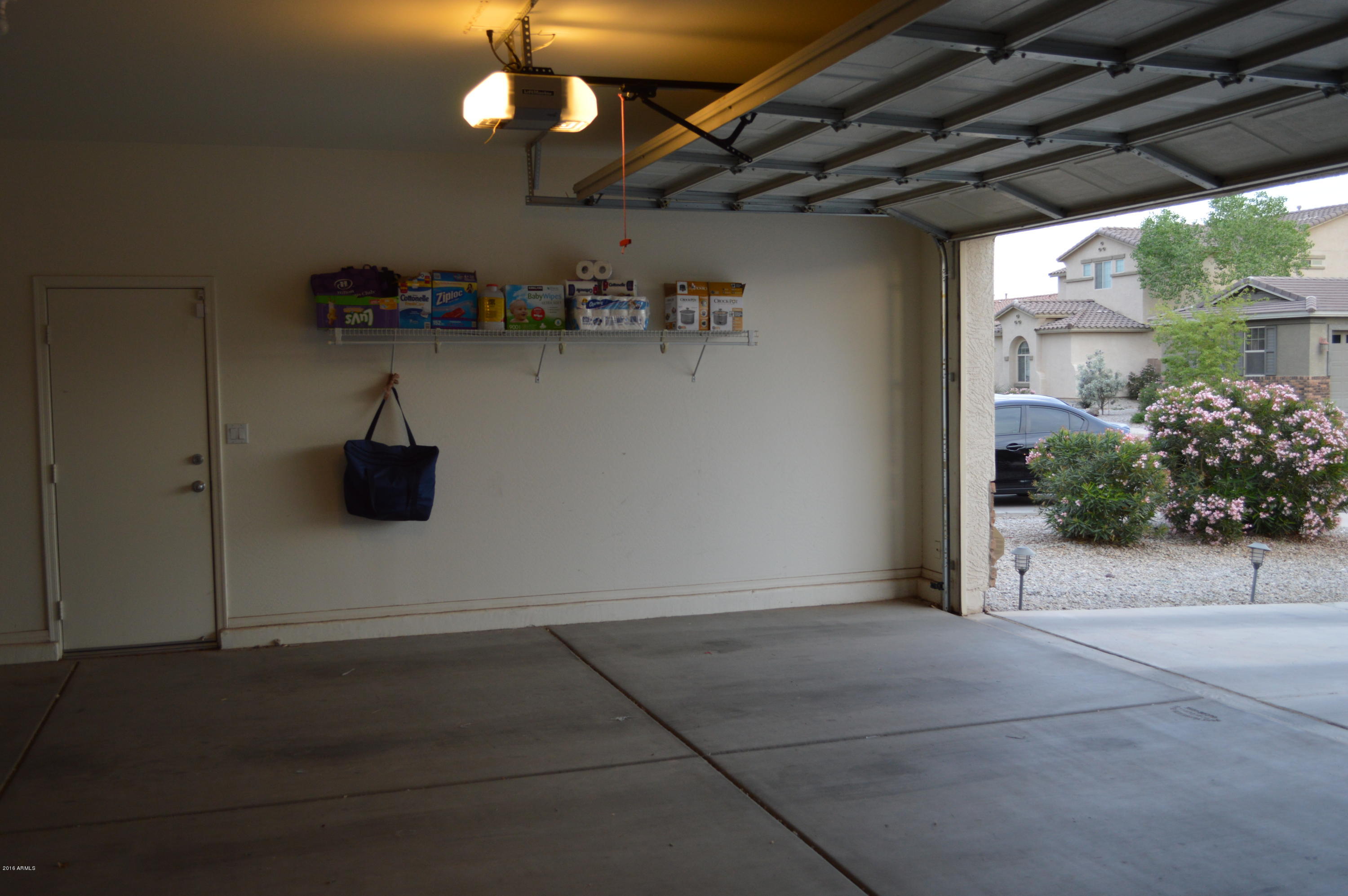 7210 West Carter Road Laveen, AZ 85339 - Photo 39 of 41 Garage with Utility Access Door