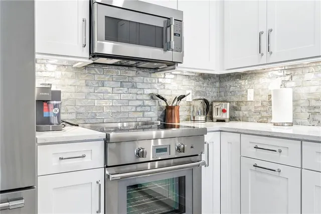 a kitchen with a stove and a microwave