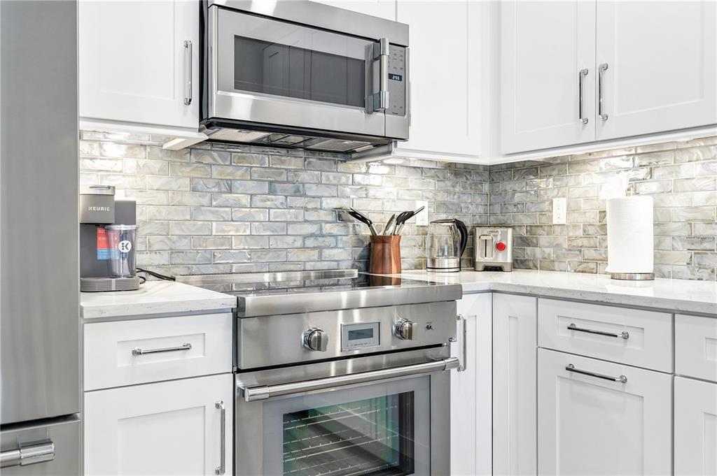 1234 15th Street, Unit 201 Sarasota, FL 34236 - Photo 13 of 29 a kitchen with a stove and a microwave