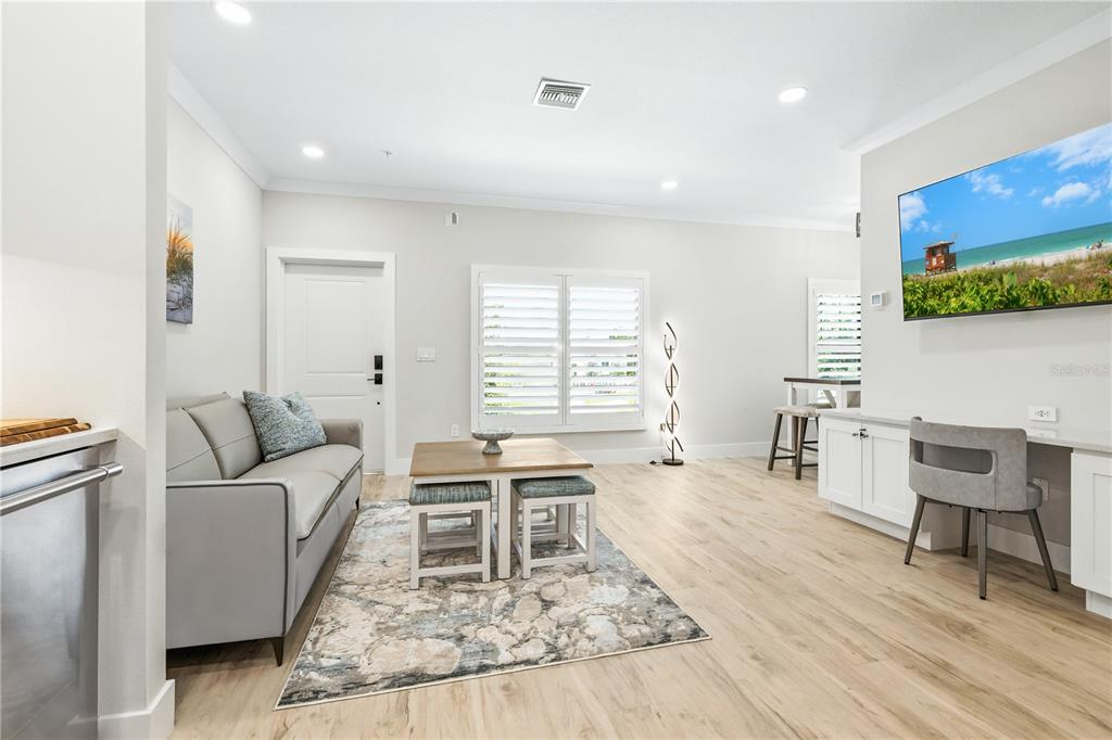 1234 15th Street, Unit 201 Sarasota, FL 34236 - Photo 14 of 29 a living room with furniture and a wooden floor
