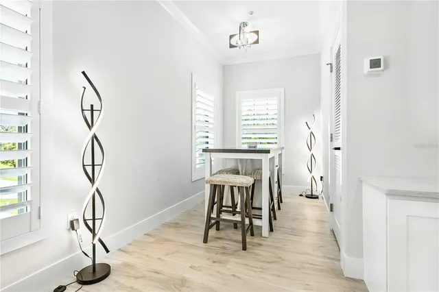 a view of a room with furniture and wooden floor