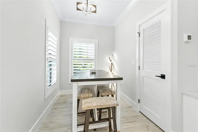 a dining room with furniture and window