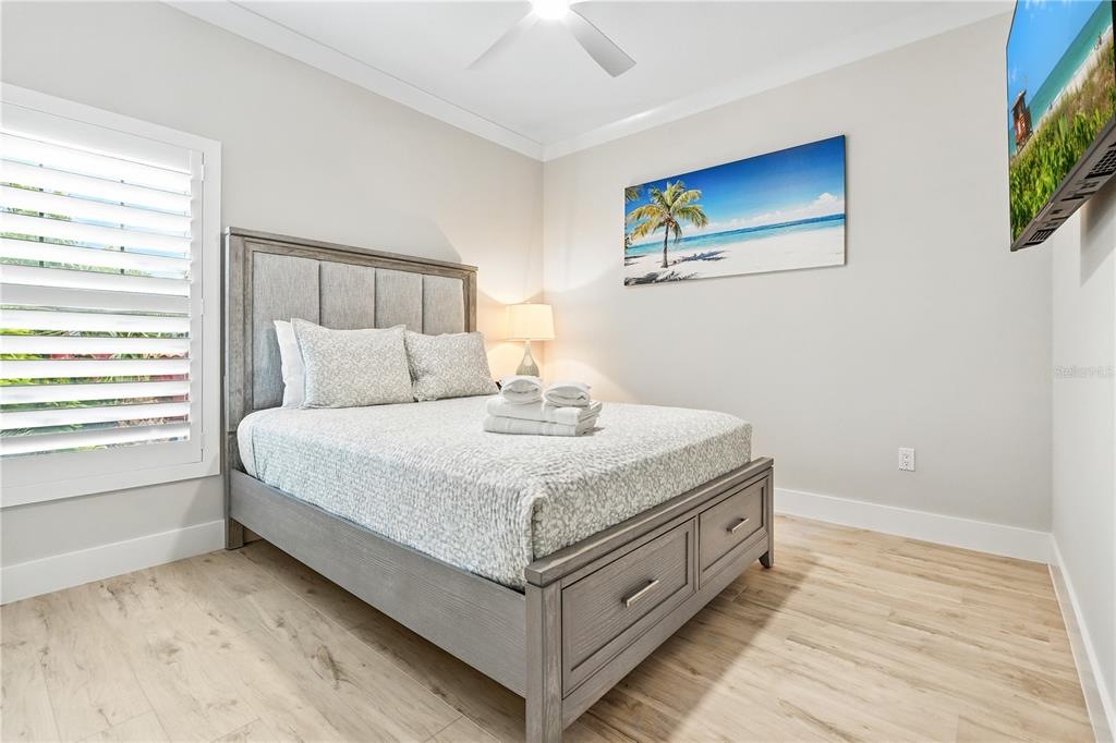 1234 15th Street, Unit 201 Sarasota, FL 34236 - Photo 18 of 29 a bedroom with a bed and a window