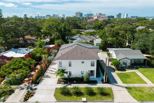 a aerial view of a house with a yard and plants