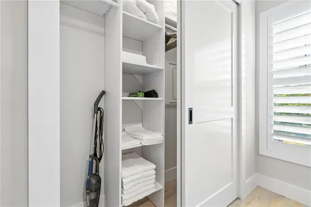 a view of a bathroom from a hallway