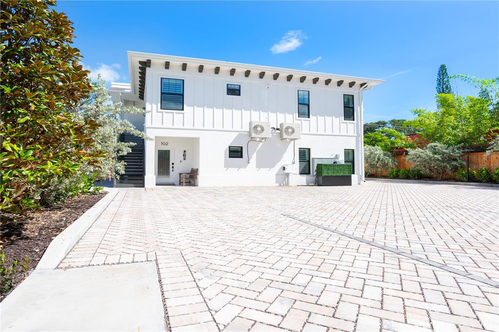 1234 15th Street, Unit 201 Sarasota, FL 34236 - Photo 28 of 29 a view of a white building with grey walls