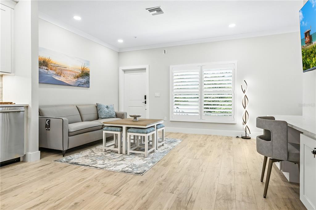1234 15th Street, Unit 201 Sarasota, FL 34236 - Photo 8 of 29 a living room with furniture and a wooden floor